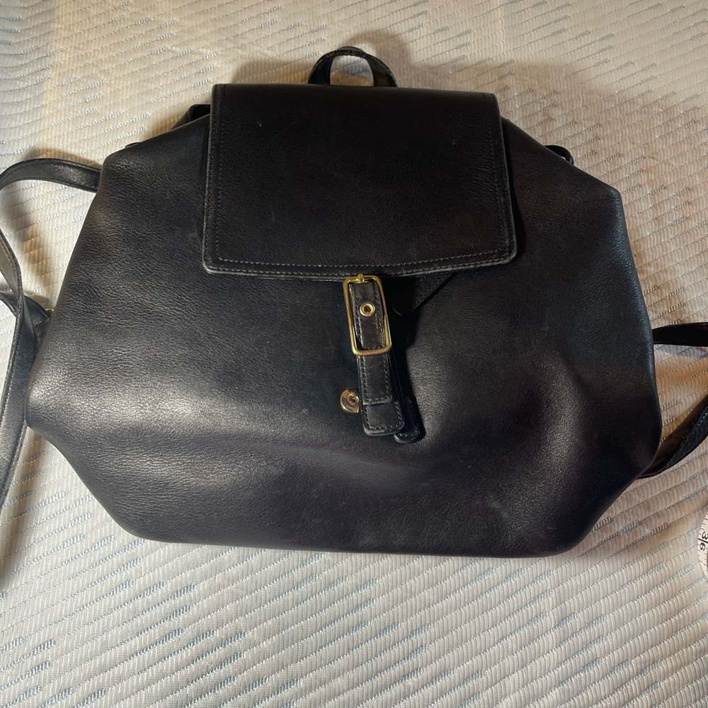 VINTAGE COACH NAVY LEATHER Backpack with brass hardware.